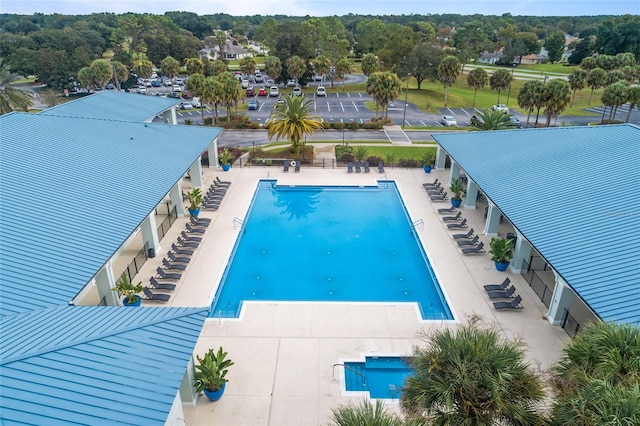 view of swimming pool with a patio