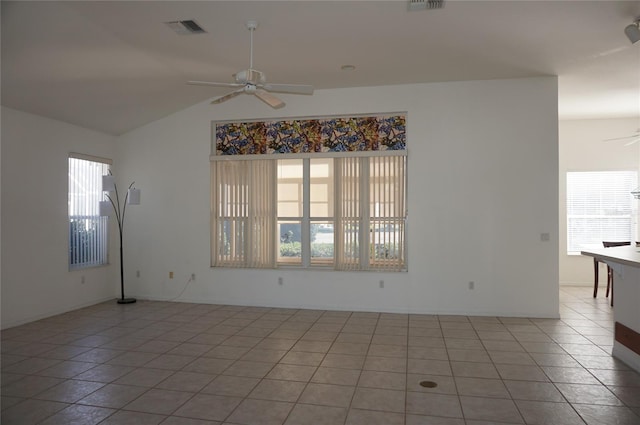 tiled spare room with ceiling fan and lofted ceiling