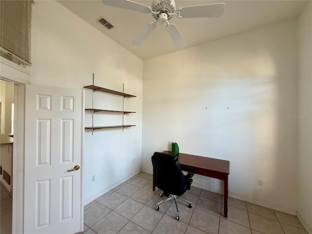 office area featuring a ceiling fan, visible vents, baseboards, and light tile patterned floors