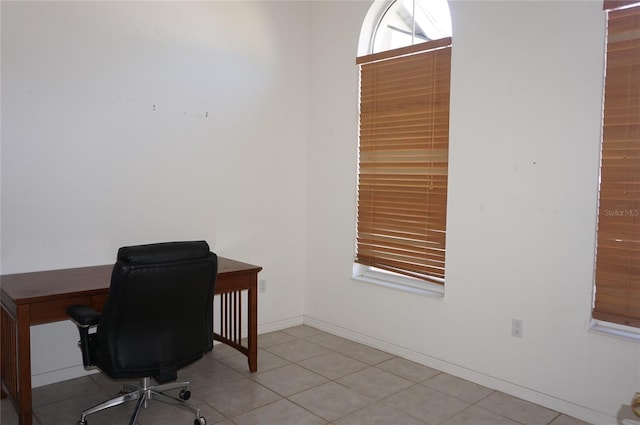 home office featuring plenty of natural light and baseboards