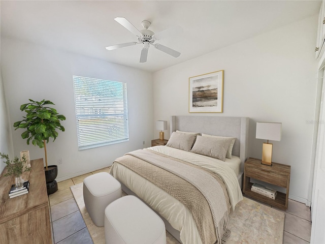 bedroom featuring ceiling fan and light tile patterned flooring