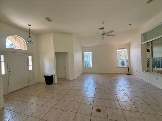 6688 SW 113th Pl, Ocala, FL 34476 - foyer entrance featuring a ceiling fan, light tile patterned floors, baseboards, and lofted ceiling