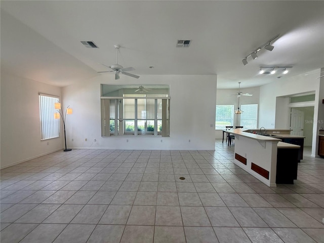 6688 SW 113th Pl, Ocala, FL 34476 - empty room with a ceiling fan, light tile patterned floors, and baseboards