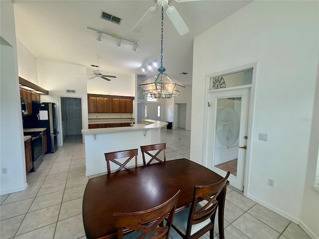 6688 SW 113th Pl, Ocala, FL 34476 - dining area with a ceiling fan, light tile patterned flooring, rail lighting, a chandelier, and baseboards