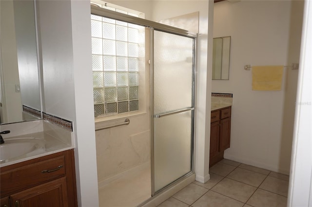 6688 SW 113th Pl, Ocala, FL 34476 - full bath featuring vanity, a shower stall, tile patterned flooring, and baseboards