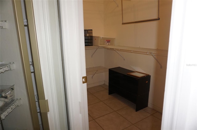 6688 SW 113th Pl, Ocala, FL 34476 - spacious closet featuring light tile patterned floors