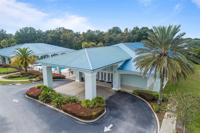 6688 SW 113th Pl, Ocala, FL 34476 - view of building exterior featuring asphalt driveway and a carport