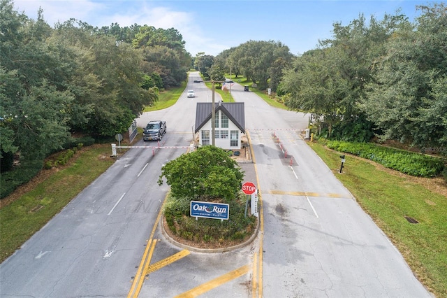 6688 SW 113th Pl, Ocala, FL 34476 - view of asphalt street with traffic signs
