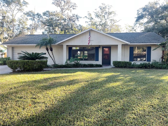 single story home featuring a garage and a front yard