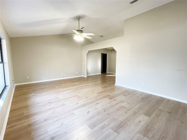 unfurnished room with light hardwood / wood-style flooring, ceiling fan, and lofted ceiling