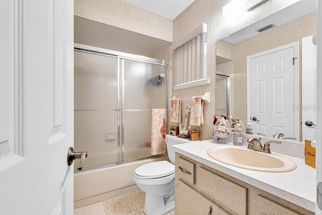 full bathroom with vanity, enclosed tub / shower combo, a textured ceiling, and toilet