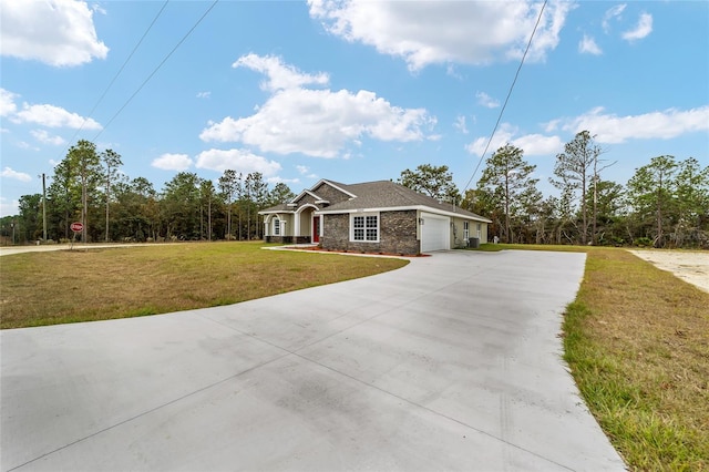 single story home with a garage and a front lawn