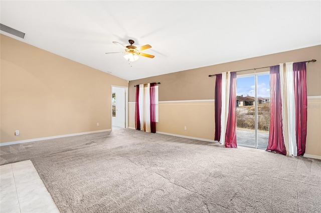 carpeted empty room featuring ceiling fan and lofted ceiling