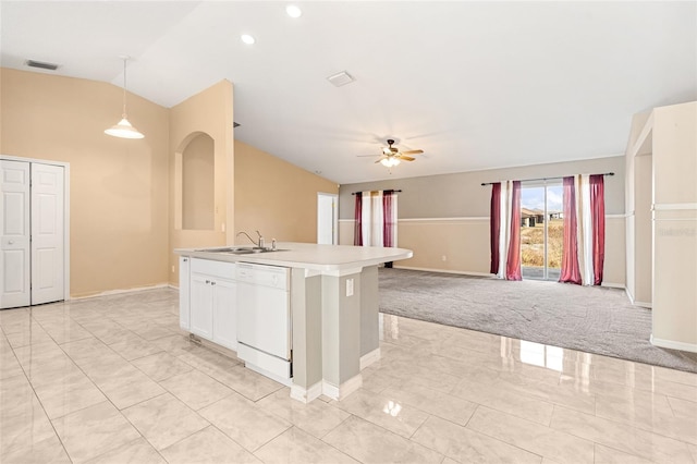 kitchen featuring dishwasher, sink, an island with sink, decorative light fixtures, and light colored carpet