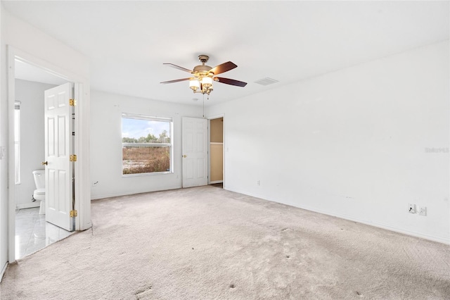 carpeted empty room with ceiling fan