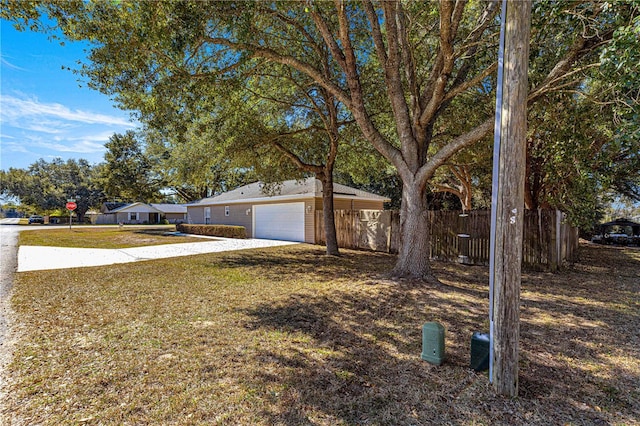 view of yard featuring a garage