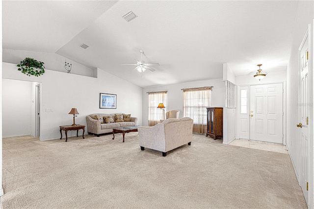 living room with light carpet, ceiling fan, and lofted ceiling