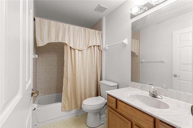 full bathroom with vanity, shower / bath combo, a textured ceiling, and toilet