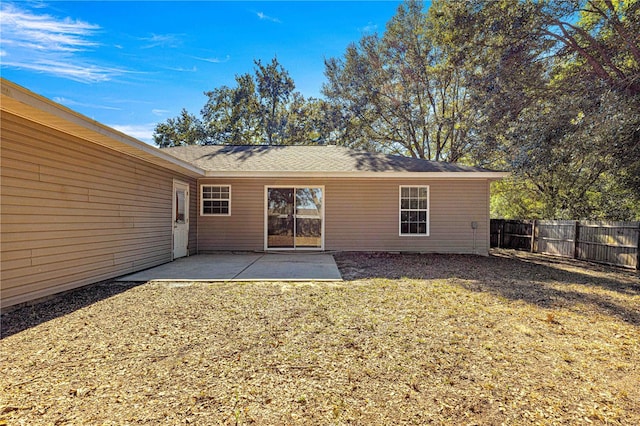 rear view of property featuring a patio area