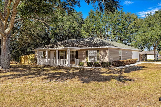 ranch-style home with a porch and a front yard