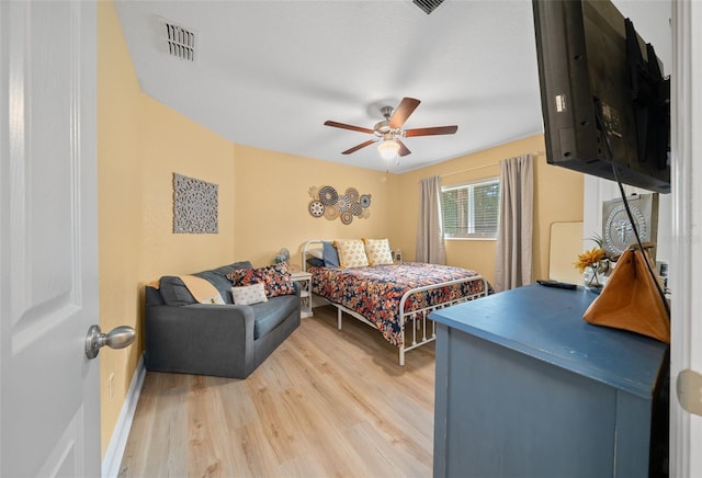 bedroom featuring light wood-type flooring and ceiling fan