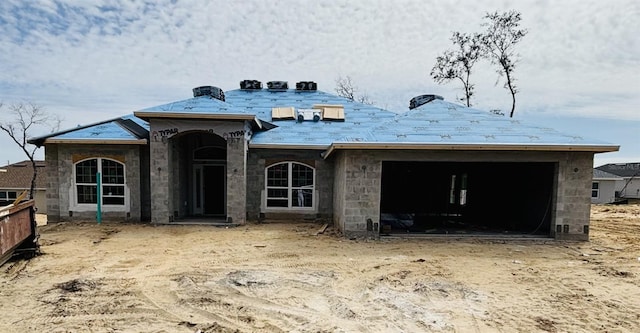 property in mid-construction featuring a garage