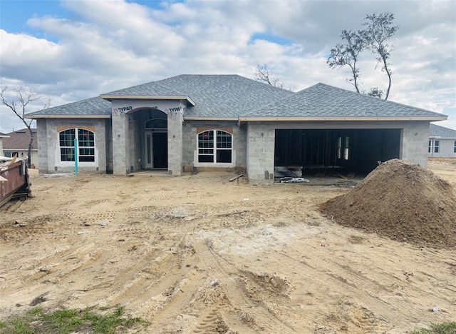 view of front of home featuring a shingled roof