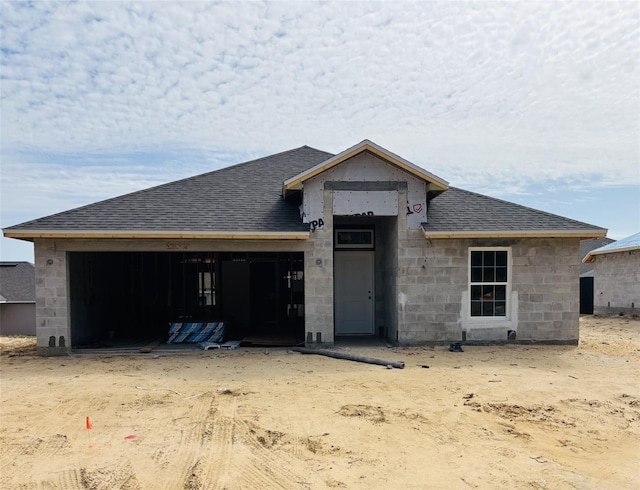 unfinished property with a garage