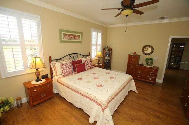 bedroom featuring multiple windows, ceiling fan, and dark wood-type flooring