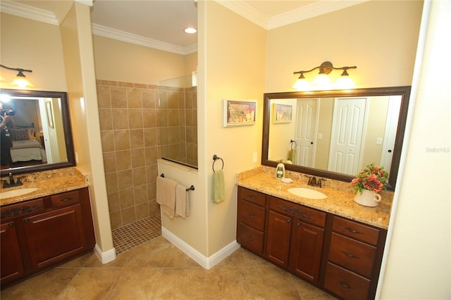 bathroom featuring tile patterned floors, vanity, a shower, and ornamental molding