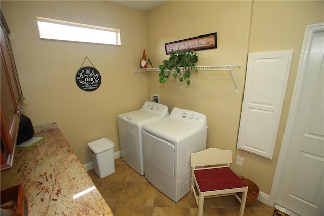 laundry room with washing machine and clothes dryer