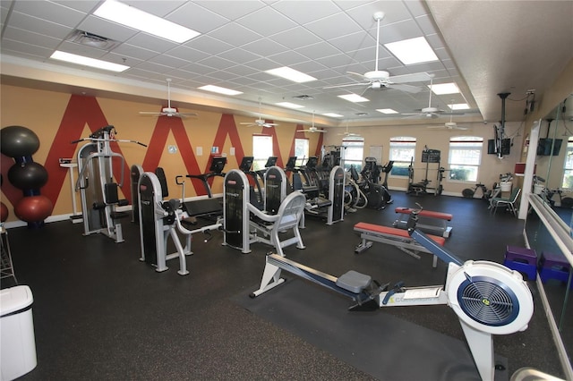 exercise room featuring a drop ceiling and ceiling fan