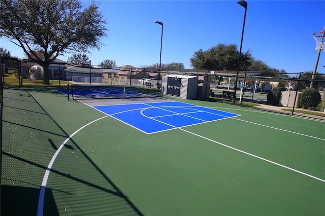 view of sport court with tennis court