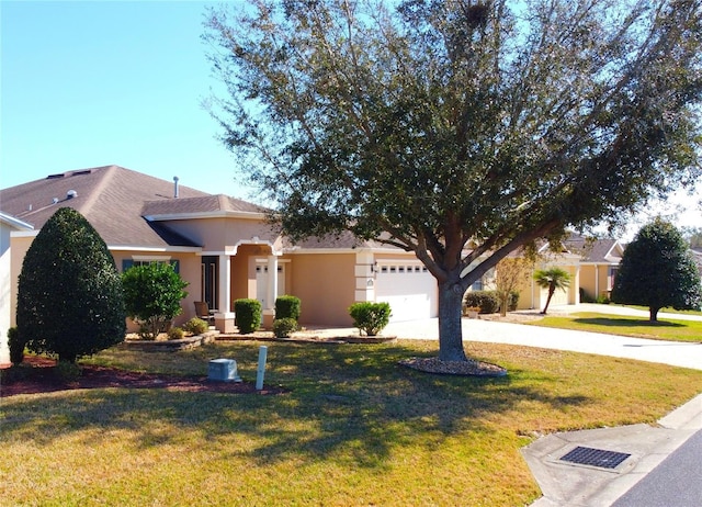 view of front facade with a garage and a front yard