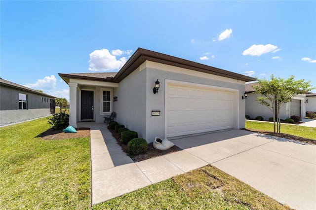 view of front of home featuring a front yard and a garage