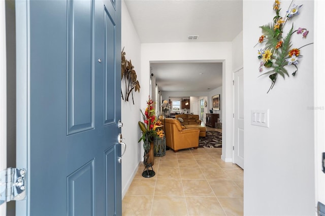 entrance foyer with light tile patterned floors