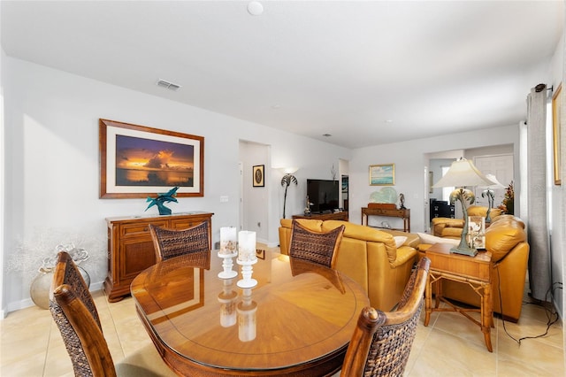 dining area with light tile patterned flooring