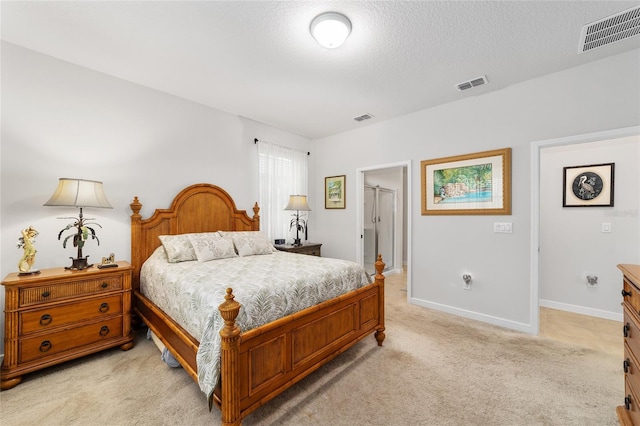 carpeted bedroom with a textured ceiling