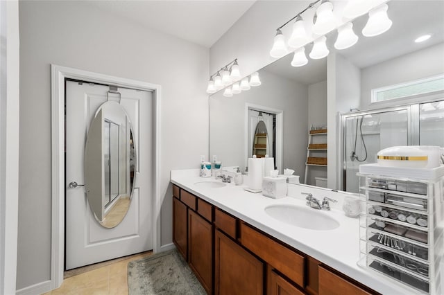 bathroom with vanity, tile patterned floors, and an enclosed shower