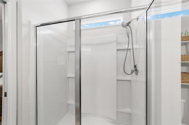 bathroom featuring an enclosed shower