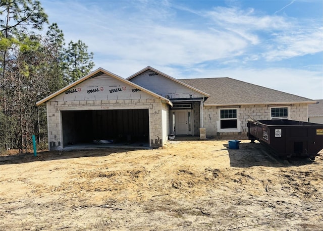 property in mid-construction featuring a garage