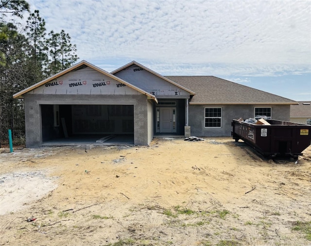 property in mid-construction with a garage