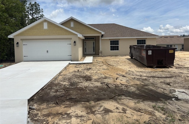 708 W Hallam Dr, Citrus Springs, FL 34434 - ranch-style house featuring an attached garage, stucco siding, and driveway
