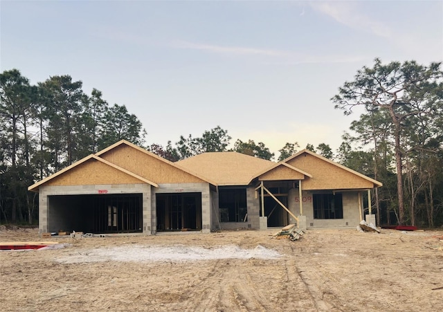 unfinished property with a garage