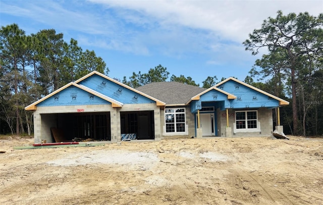 unfinished property with a garage