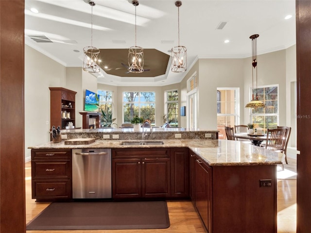 kitchen featuring dishwasher, sink, light stone counters, crown molding, and light wood-type flooring