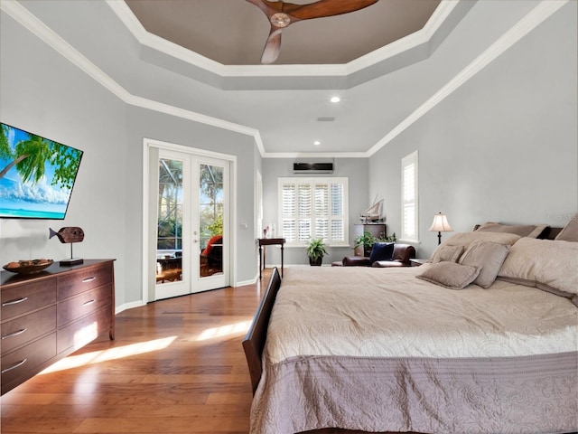 bedroom with ceiling fan, french doors, wood-type flooring, access to outside, and ornamental molding