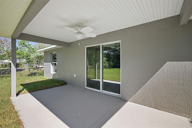 view of patio with a ceiling fan and fence