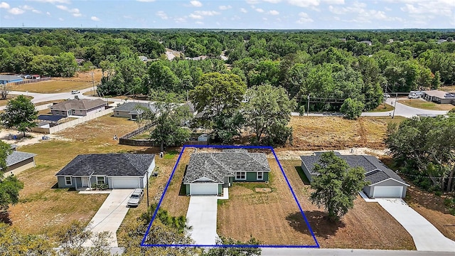 drone / aerial view with a view of trees