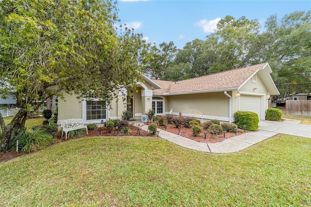 view of front of property with a garage and a front lawn